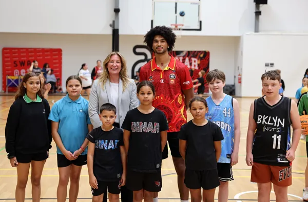 Angela Newland and Keanu Pinder with some of the Binar basketball program participants